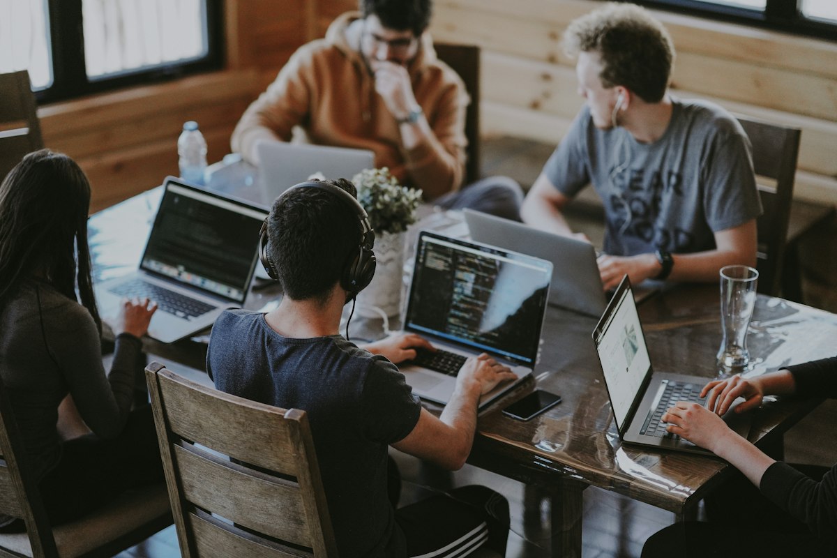 http://Developers%20collaborating%20on%20custom%20software%20at%20a%20shared%20workspace